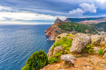 Beautiful panoramic landscape with sea coast in mountain area. Picturesque seascape with sky, water and coastline in autumn cloudy day. Black sea, Sevastopol vicinity, Crimea, Russia