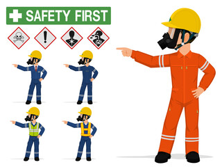 An industrial worker with respirator is pointing to something.