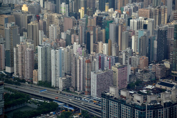 Fototapeta na wymiar High buildings skyscrapers and road in Hong Kong