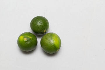 Isolated green lemon on white background