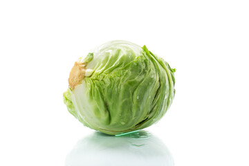early green cabbage, whole swing on a white background