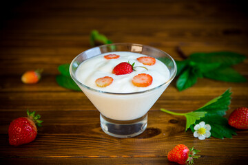 sweet homemade yogurt with red ripe fresh strawberries
