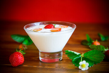 sweet homemade yogurt with red ripe fresh strawberries