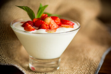 sweet homemade yogurt with red ripe fresh strawberries
