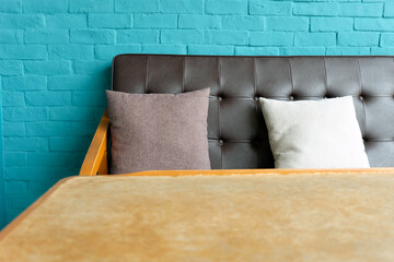Detail of Living room with Leather sofa on blue brick wall Background