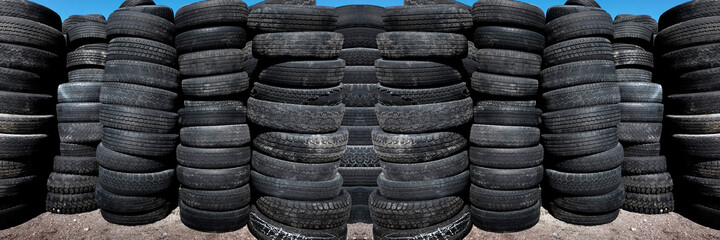 Fototapeta na wymiar Pile and Stacks of Old Worn Used Tires