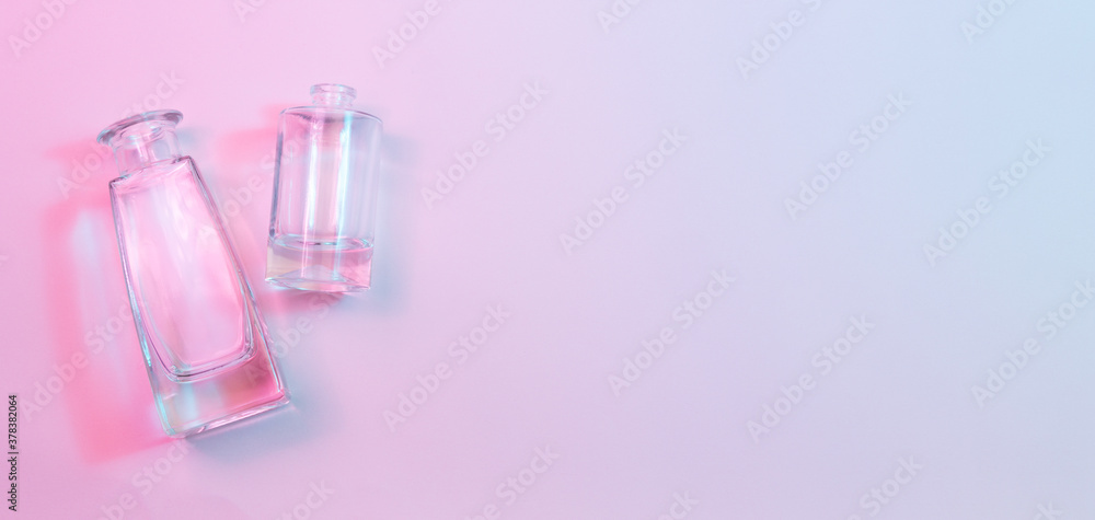 Wall mural concept with one cylindrical round-bottom and one shaped square-bottom crystal clear clean empty gla