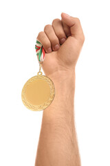Fototapeta na wymiar Man holding golden medal on white background, closeup. Space for design