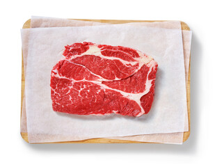 Raw steak in a studio setting, isolated on white