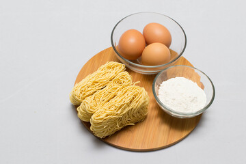 Raw homemade Egg noodles and ingredients for Egg noodles
