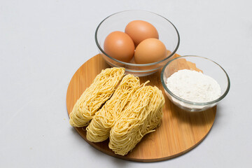 Raw homemade Egg noodles and ingredients for Egg noodles