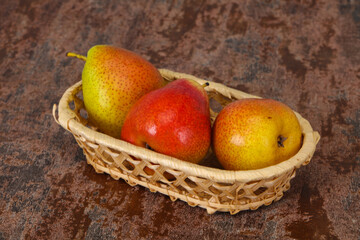 Pear heap in the wooden basket