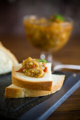 cooked eggplant caviar with spices on a wooden table