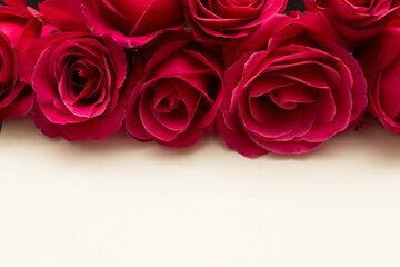 red roses and white card with a place for a congratulatory text on a black background