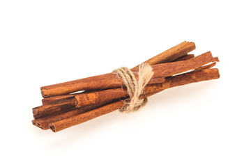 Cinnamon sticks heap isolated on white