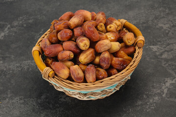 Sweet tasty dry dates in the basket