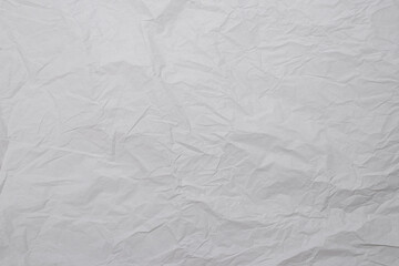 Crumpled white paper background.