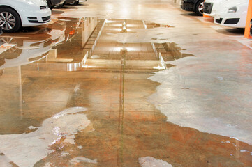 Parking flooded with water due to external leaks
