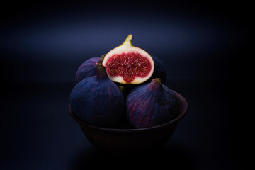 Tasty figs on a black background. Top view.