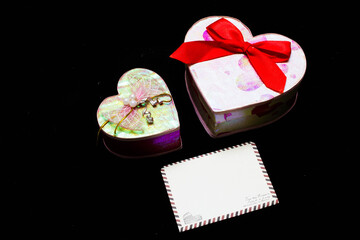 purple daisies and white card with a place for a congratulatory text on a black background