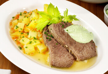 Traditional boiled Beef with green Herb Sauce - German Tafelspitz