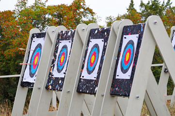 Series of archery targets in wooden stands