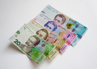 Ukrainian banknotes of twenty, one hundred, two hundreds and one thousand hryvnias isolated on white background