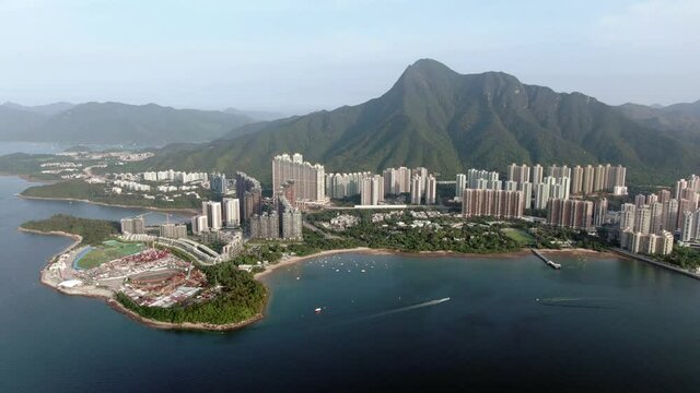 Aerial view of Hong Kong Wu Kai Sha area with modern residential building complex and Tolo Harbour open bay