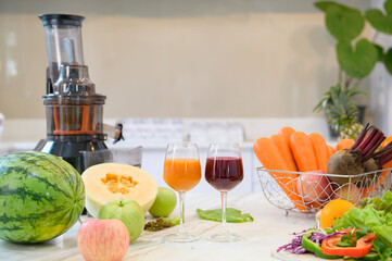 Healthy fresh fruit , vegetables and juicers are on the table in kitchen ready to be prepared, health concept