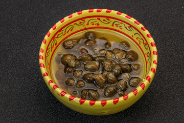 Tasty capers in the bowl