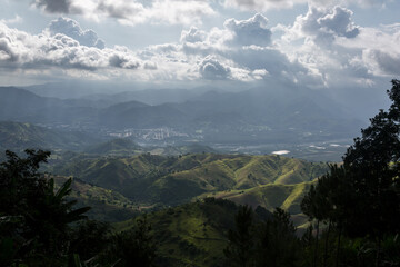 dramatic sunlit image of the caribbean mountains of dominican republic, san jose de ocoa. and taton mountainside.