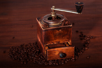 Old coffee grinder on the table.