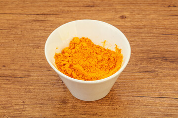 Tumeric powder in the bowl