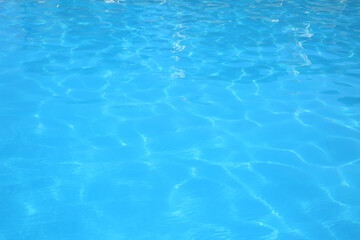 Swimming pool with clear water as background, closeup