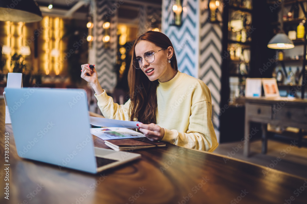 Aufkleber clever female graphic designer in optical eyeglasses working remotely on startup project puzzled on 