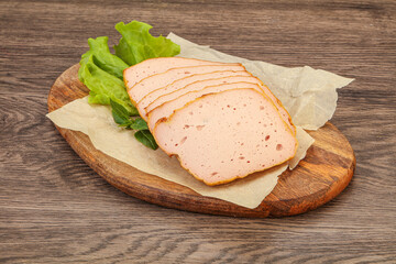 Boiled pork sausage over board