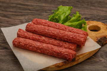 Raw beef sausages with spices