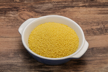 Raw cous cous heap in the bowl