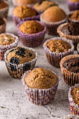 Sweet cakes or cupcakes on light marble background. Holiday cake celebration, delicious dessert, close up