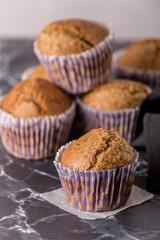 Sweet cakes or cupcakes on light marble background. Holiday cake celebration, delicious dessert, close up