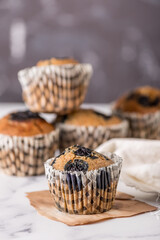 Sweet cakes or cupcakes on light marble background. Holiday cake celebration, delicious dessert, close up
