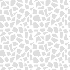 Seamless background of randomly placed sharp grey pieces. Small and large fragments. Vector illustration for wrapping paper, site, magazine, textile print. Abstract seamless pattern from the triangle