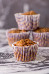 Sweet cakes or cupcakes on light marble background. Holiday cake celebration, delicious dessert, close up