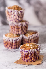 Sweet cakes or cupcakes on light marble background. Holiday cake celebration, delicious dessert, close up