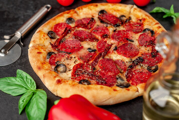pizza pepperoni with salami sausages, mozzarella, olives, Provencal herbs, signature tomato sauce...