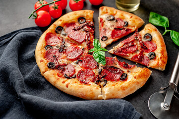 pizza pepperoni with salami sausages, mozzarella, olives, Provencal herbs, signature tomato sauce...