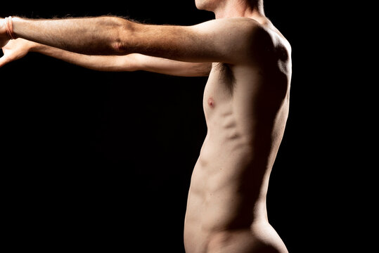Side view of a muscular naked man with kyphosis and lordosis, due to the Pectus Excavatum or sunken chest. Bad posture of the vertebral column.