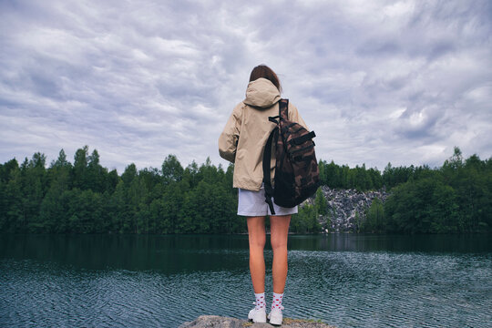Young woman at Ruskeala mountain park, Sortavala, Republic of Karelia, Russia - Powered by Adobe