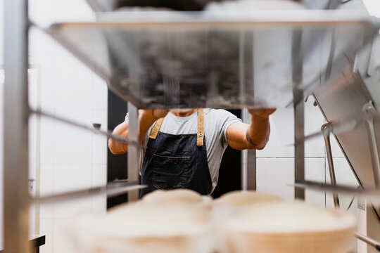 Male baker in apron at bakery