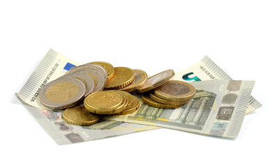 Money and expenses concept. Stacks of euro coins, euro cents and bills on a white background...